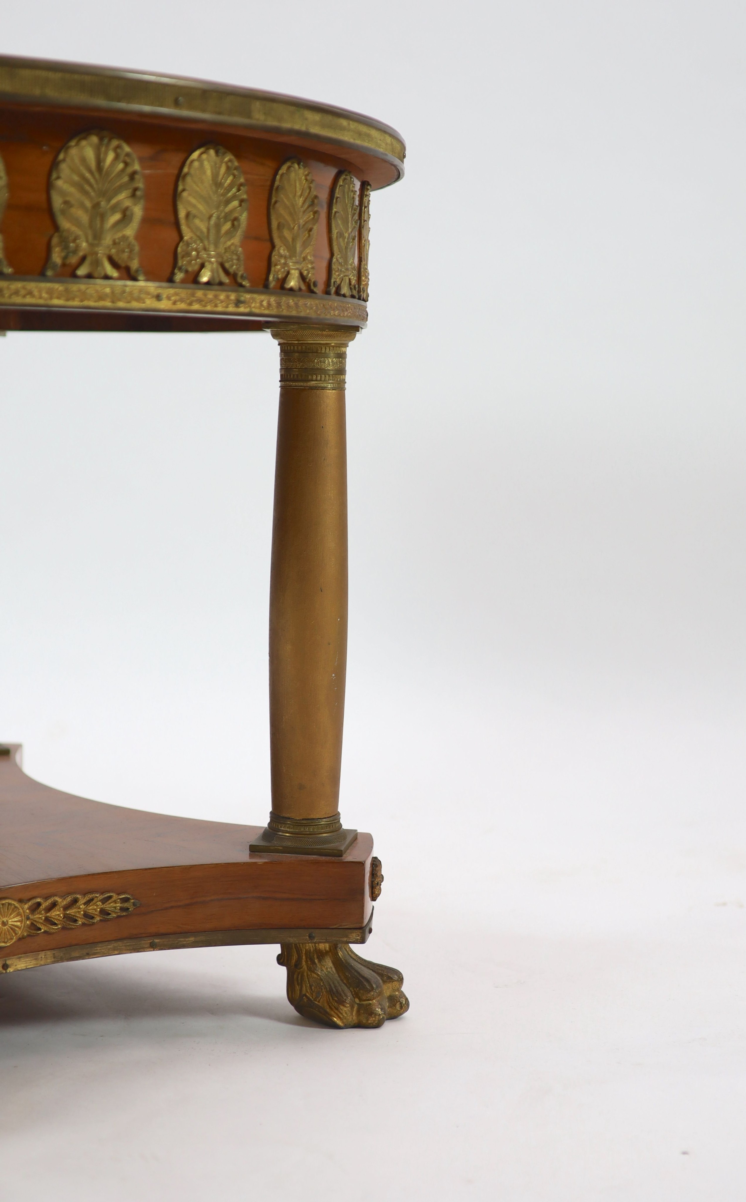 A French empire style ormolu mounted marquetry centre table Diam.81cm H.65cm